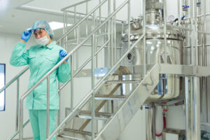 the operator controls the machine in the factory work